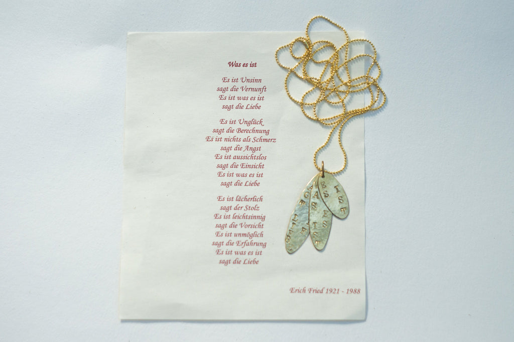 Gold pendant with engraving - It is what it is, says love