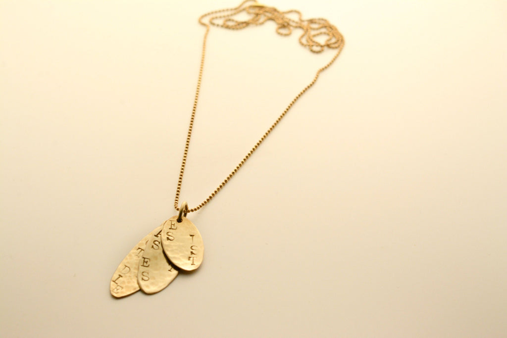 Gold pendant with engraving - It is what it is, says love