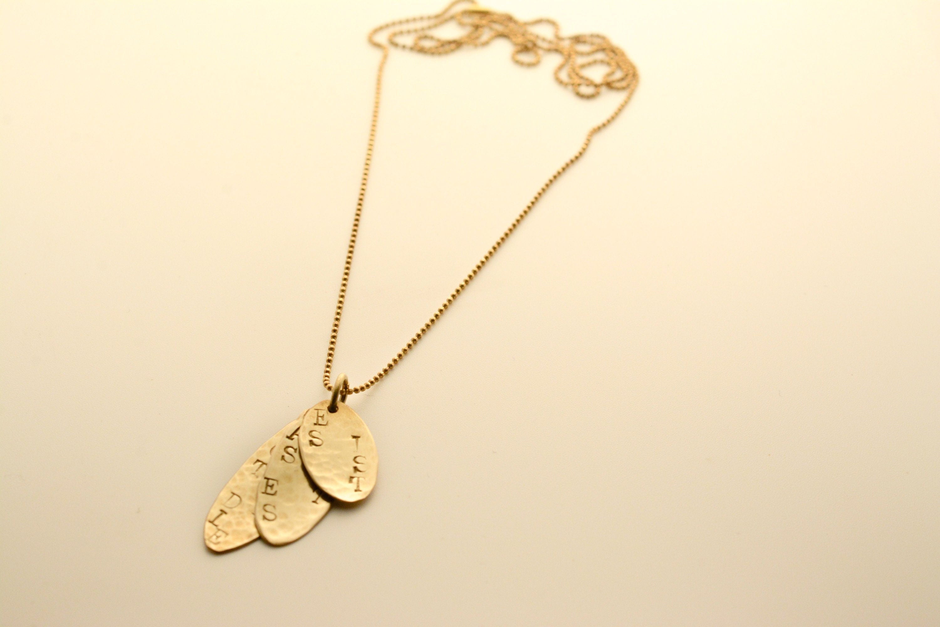 Gold pendant with engraving - It is what it is, says love