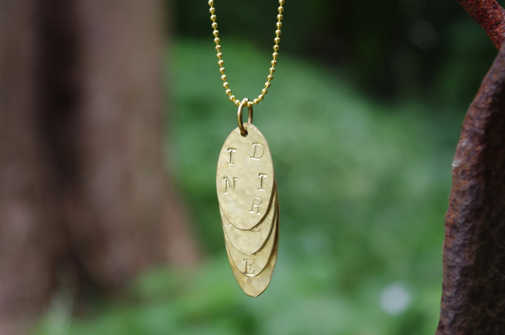 Gold pendant with engraving - It is what it is, says love
