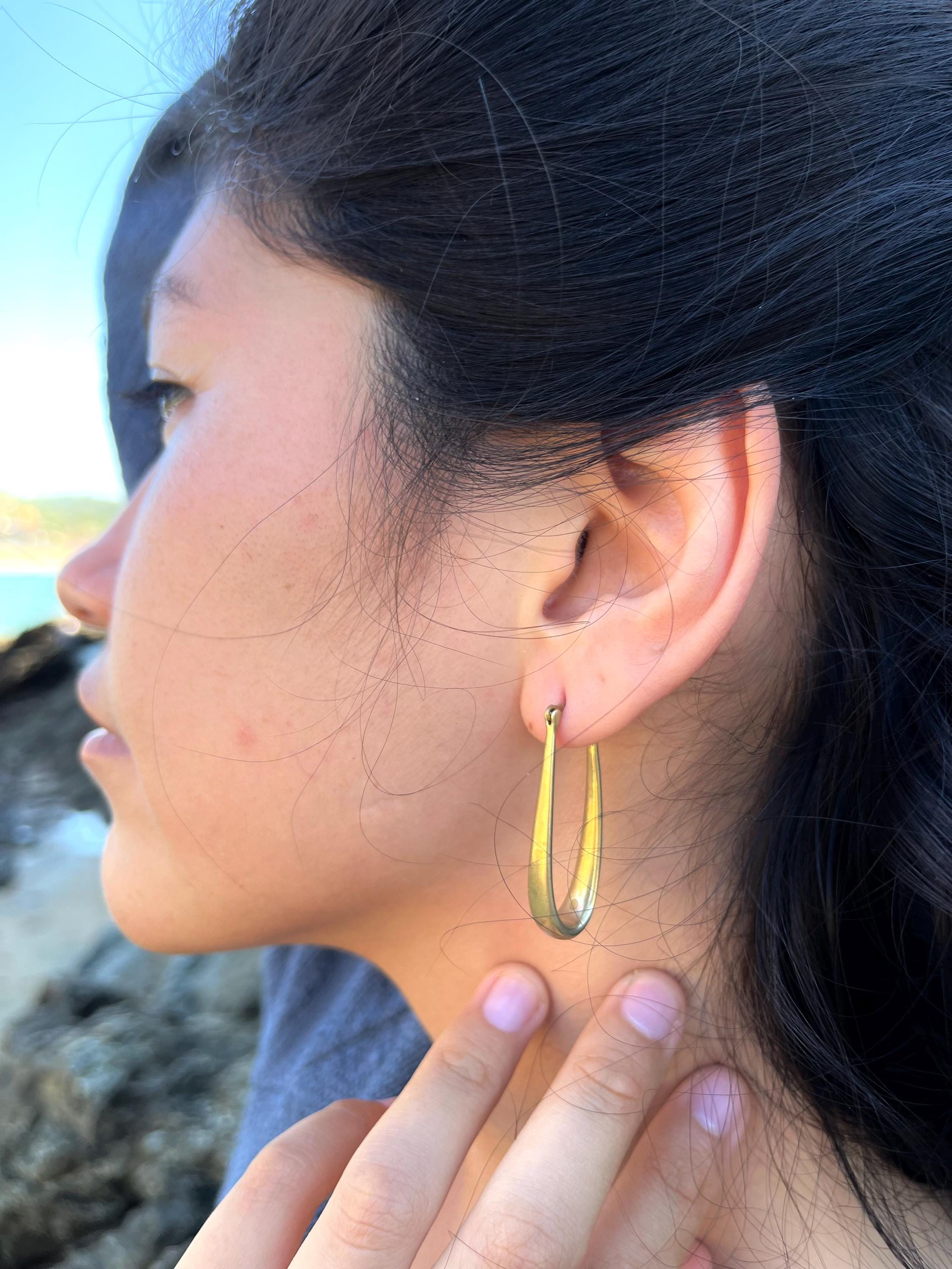 Elongated gold hoops