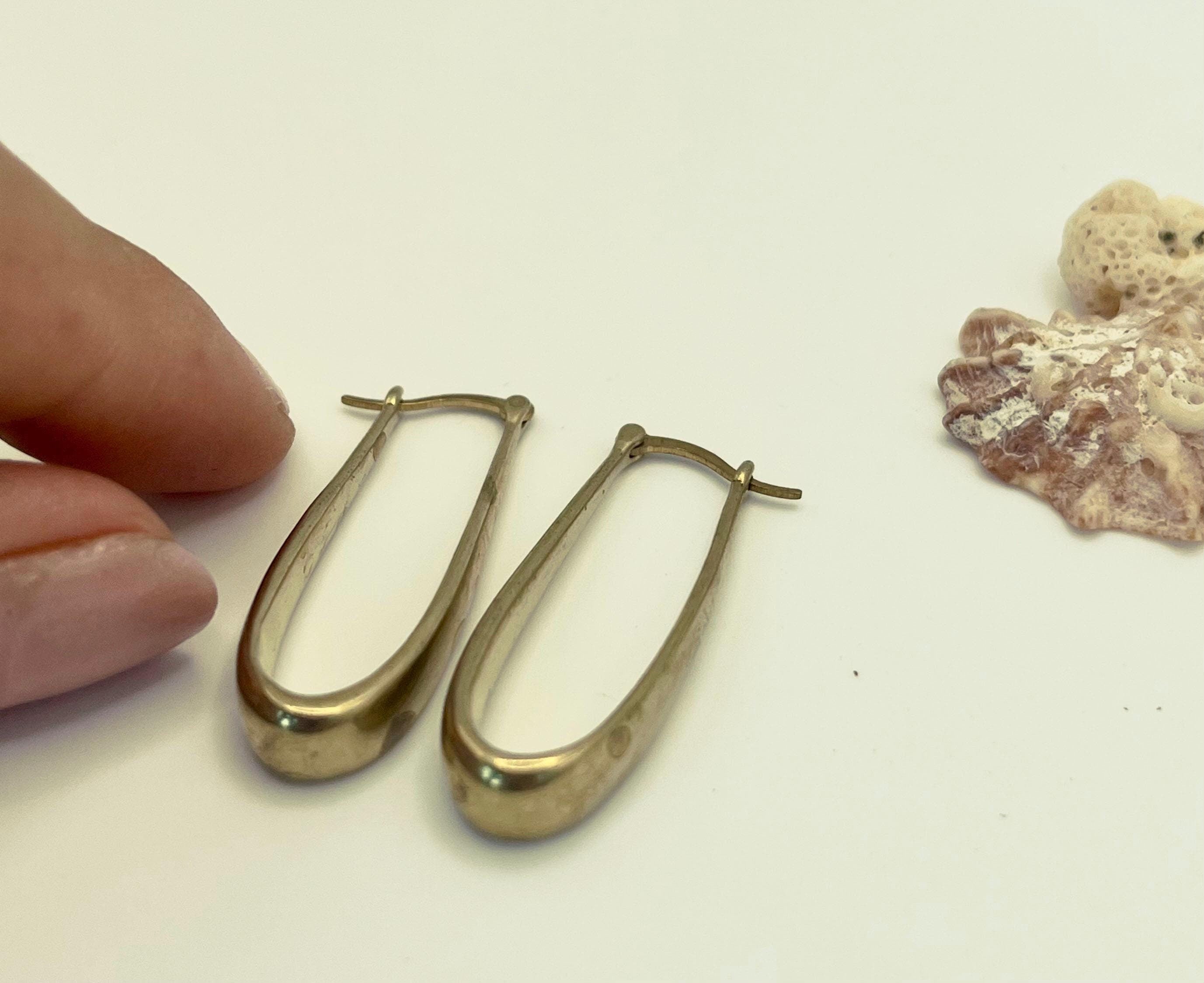 Elongated gold hoops