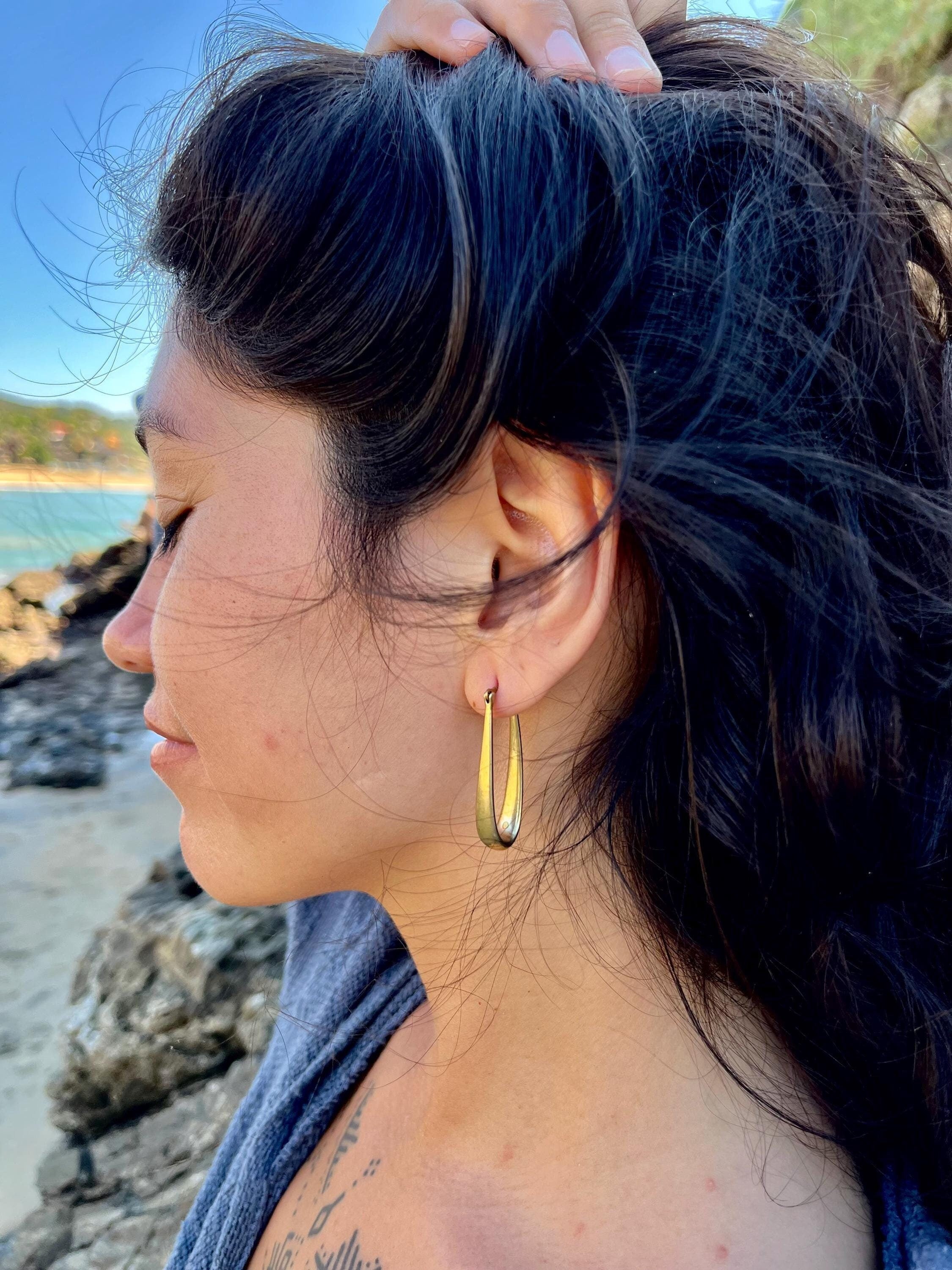 Elongated gold hoops