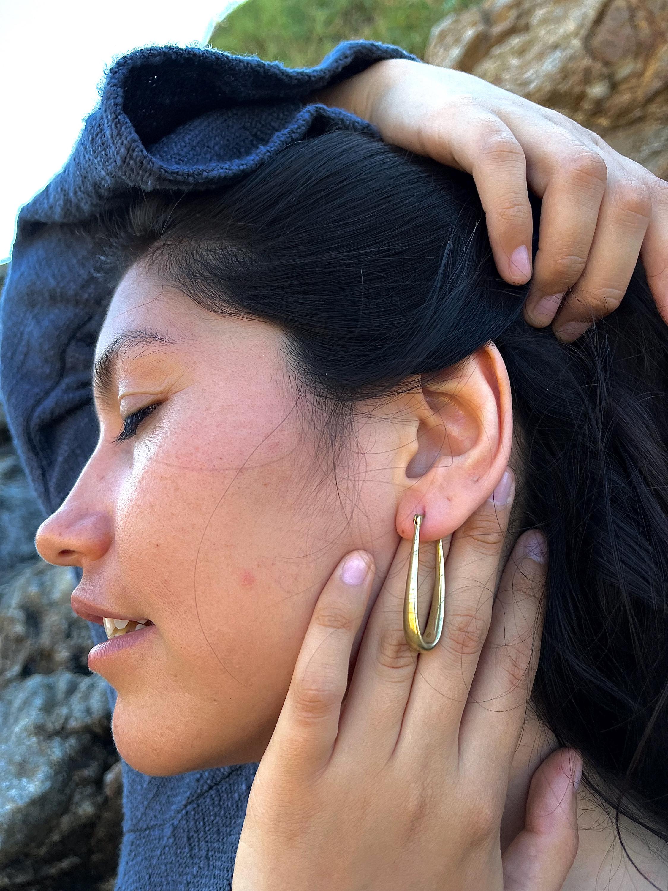 Elongated gold hoops