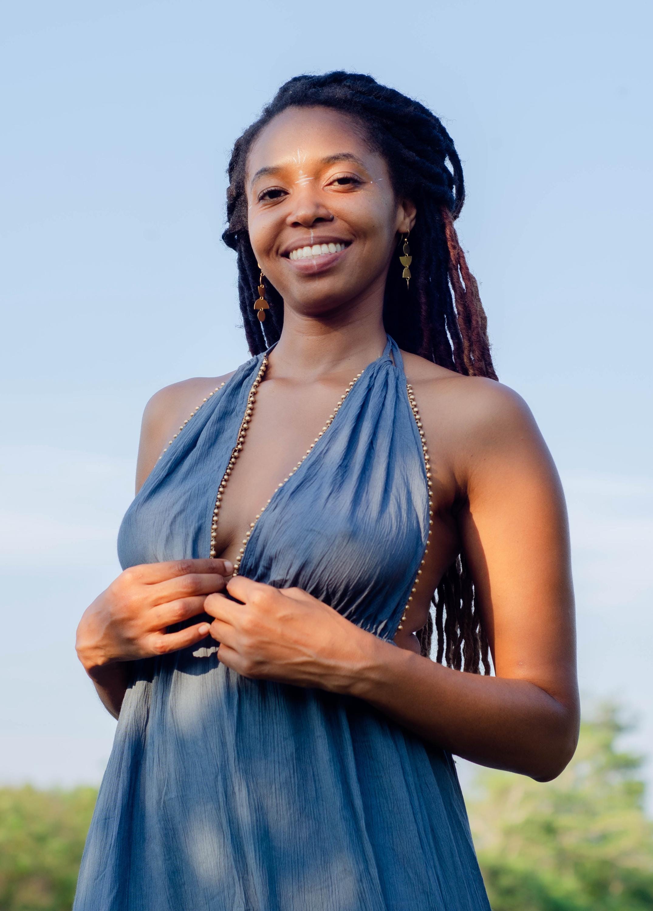 Festive boho dress with golden beads at the V-neck